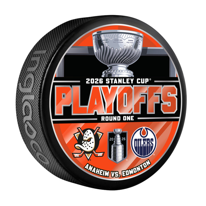Anaheim Ducks vs Edmonton Oilers NHL 2026 Stanley Cup Playoffs Round One dueling puck with orange and navy split background
