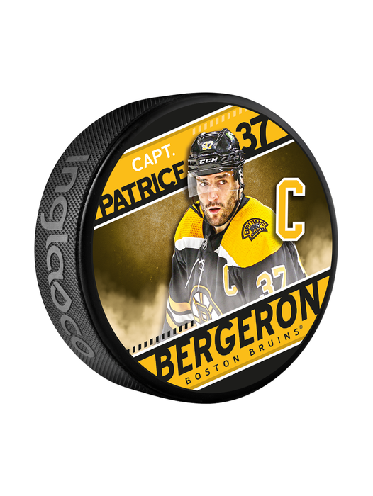 Rondelle de hockey souvenir des Bruins de Boston de la série des capitaines de la LNH, Patrice Bergeron, dans un cube
