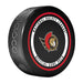 NHL Ottawa Senators official game puck face with red, gold and black centurion crest and league wordmark