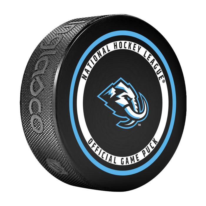 Utah Mammoth NHL Official Game Puck angled view with light blue ringed circular border around team logo