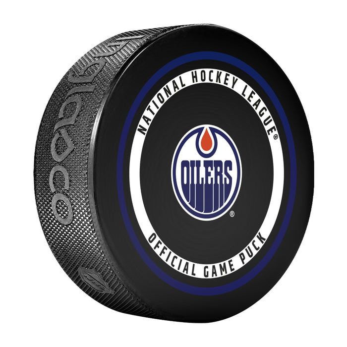 Edmonton Oilers NHL Official Game Puck angled view with blue and orange circular border around team logo