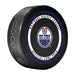 Edmonton Oilers NHL Official Game Puck angled view with blue and orange circular border around team logo