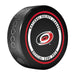 Carolina Hurricanes NHL Official Game Puck angled view with red and black circular border around team logo