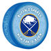 NHL Buffalo Sabres New Fan Is Born blue souvenir hockey puck with buffalo and crossed sabres logo on baby-themed background