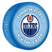 NHL Edmonton Oilers New Fan Is Born blue souvenir hockey puck with team Oilers oil drop logo on baby-themed background