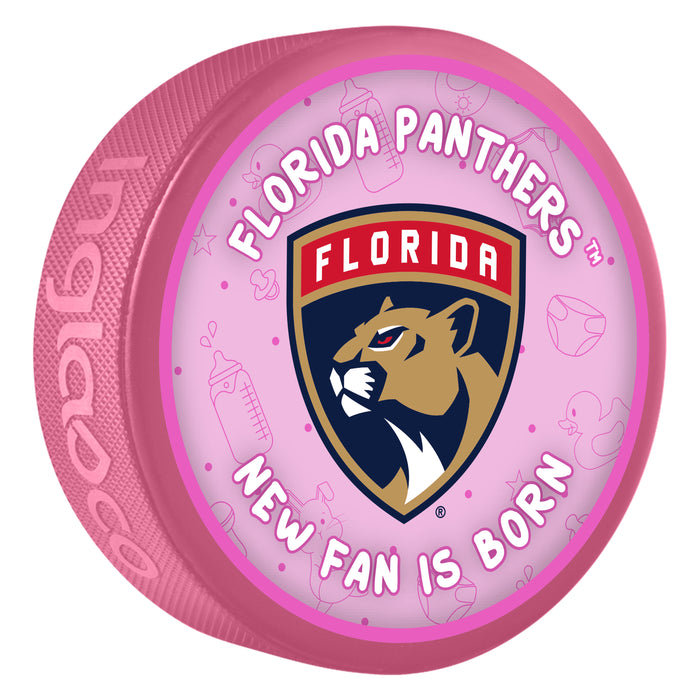 NHL Florida Panthers New Fan Is Born pink souvenir hockey puck with red and gold panther shield logo on baby-themed background