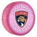 NHL Florida Panthers New Fan Is Born pink souvenir hockey puck with red and gold panther shield logo on baby-themed background