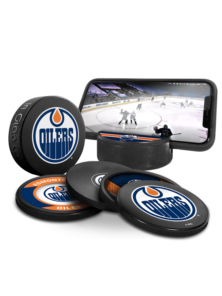 <transcy>Pack de 3 fans ultimes des Oilers d'Edmonton de la LNH. Comprend : 1 rondelle de hockey souvenir classique officielle de la LNH / 4 sous-verres / 1 support pour appareil multimédia</transcy>